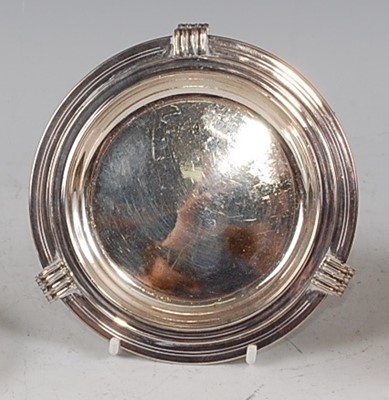 Lot 85 - An Art Deco silver bottle coaster by Mappin &...