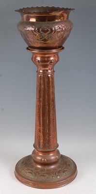 Lot 201 - An Art Nouveau embossed and hammered copper...