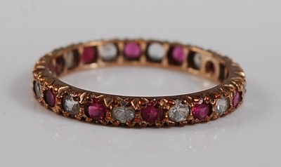 Lot 2644 - A 9ct yellow gold, synthetic ruby and sapphire...