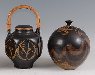 Lot 34 - A studio pottery swing handle jar and cover, ...