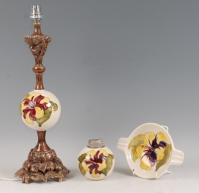 Lot 6 - A Moorcroft Hibiscus pattern pottery table...