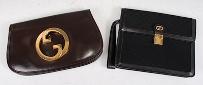 Lot 145 - A Gucci lady's chocolate brown leather clutch...