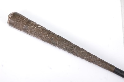 Lot 1370 - A circa 1900 Indian embossed silver capped and...