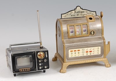 Lot 177 - A Japanese novelty table lighter in the form...