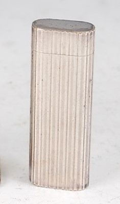 Lot 188 - A Cartier white metal pocket cigarette lighter,...