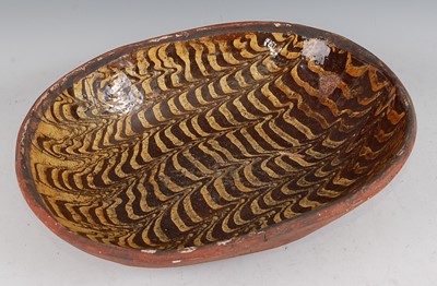 Lot 1032 - *An English slipware baking dish, late 18th /...