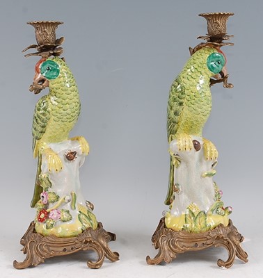 Lot 1069 - A pair of reproduction porcelain candlesticks,...