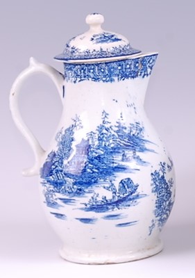 Lot 1038 - A Lowestoft porcelain milk jug and cover, blue...