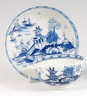 Lot 1040 - A Lowestoft porcelain tea bowl and saucer,...