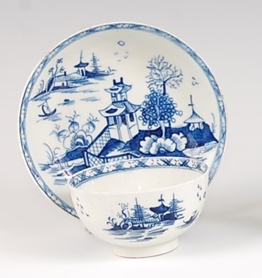 Lot 1040 - A Lowestoft porcelain tea bowl and saucer,...