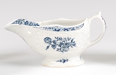 Lot 1041 - A Lowestoft porcelain moulded sauce-boat,...