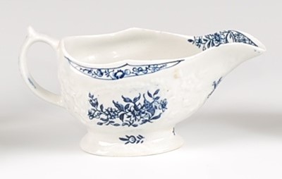 Lot 1041 - A Lowestoft porcelain moulded sauce-boat,...