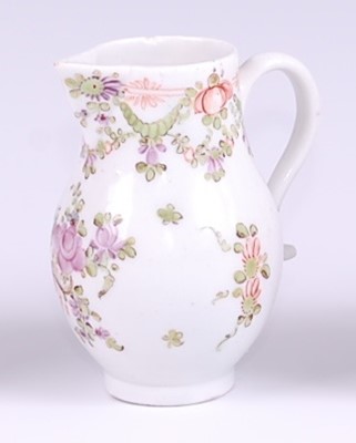 Lot 1047 - A Lowestoft porcelain sparrow-beak cream jug, ...