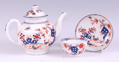 Lot 1036 - A Lowestoft porcelain bullet shaped teapot and...