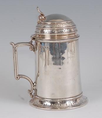 Lot 1172 - A mid-Victorian silver lidded tankard, in the...