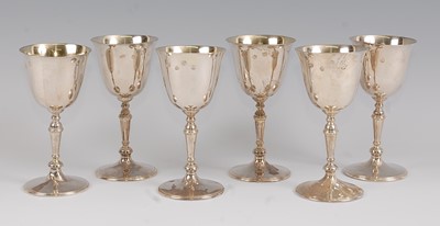 Lot 1173 - A set of six modern silver pedestal wine...