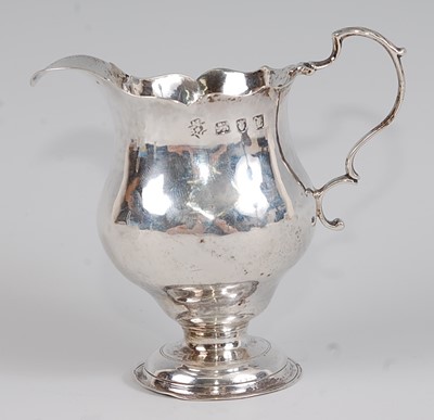 Lot 1179 - *An early George III silver pedestal cream jug,...