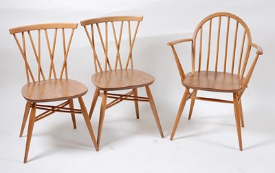 Lot 355 - A pair of 1960s Ercol light elm stickback...