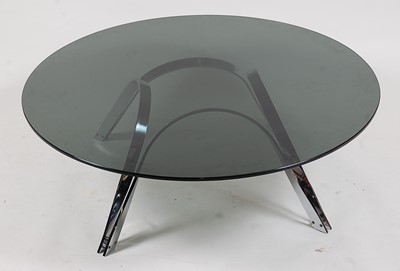 Lot 357 - A large 1980s heavy smoky glass topped...
