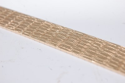 Lot 1211 - A modern 9ct gold textured link bracelet, with...