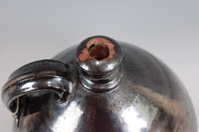 Lot 1033 - An early 19th century earthenware bellamine...