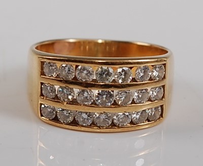 Lot 2679 - A yellow metal diamond three-row half hoop...
