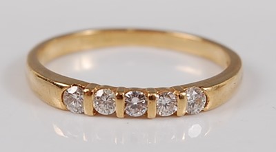 Lot 2599 - An 18ct yellow gold diamond five stone half...