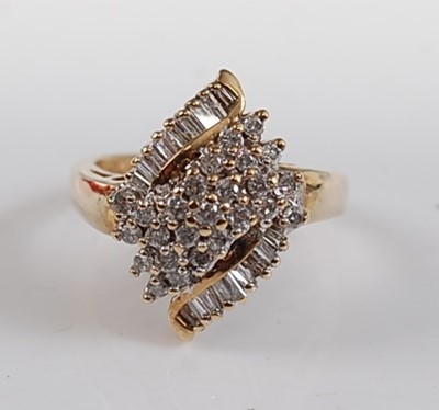 Lot 2580 - A 9ct yellow gold diamond marquise shaped...