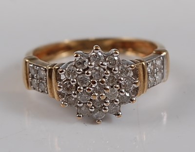 Lot 2615 - A 9ct yellow and white gold diamond circular...