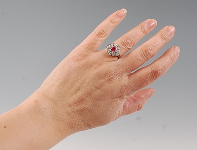 Lot 2535 - A white metal, ruby and diamond Art Deco style...