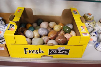 Lot 222 - A collection of polished hardstone eggs to...