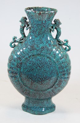Lot 44 - A Chinese export turquoise glazed moon vase,...