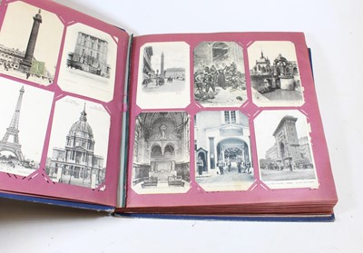 Lot 493 - An early 20th century postcard album and...