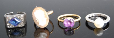 Lot 335 - A yellow metal carved shell cameo dress ring,...