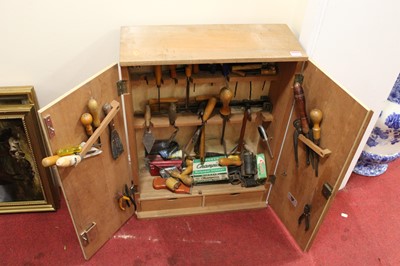 Lot 514 - A 20th century plywood tool chest containing...
