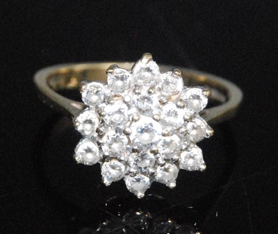 Lot 2553 - A 9ct yellow and white gold sapphire circular...