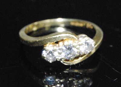 Lot 2594 - An 18ct yellow gold diamond crossover style...
