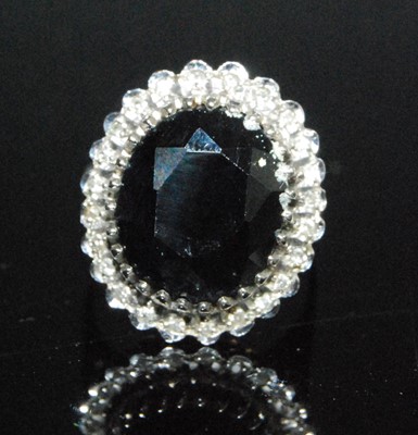 Lot 2550 - A 9ct yellow and white gold, sapphire and...