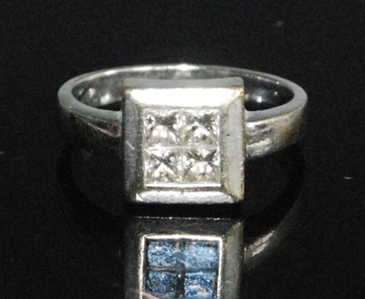 Lot 2595 - A white metal diamond quatrefoil cluster ring,...