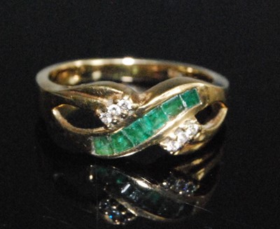 Lot 2596 - A yellow metal two-strand crossover style ring,...