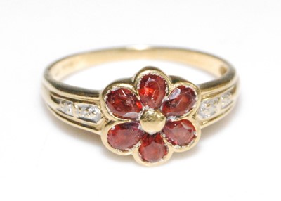 Lot 2617 - An 18ct yellow gold garnet flower shaped...