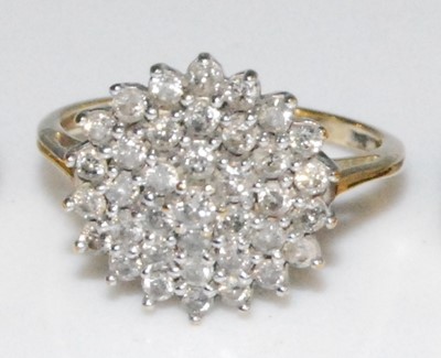 Lot 2618 - A 9ct yellow and white gold diamond circular...
