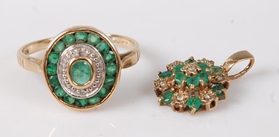 Lot 2564 - A 9ct gold emerald set dress ring, arranged as...