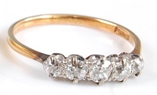 Lot 2665 - An 18ct gold diamond five stone ring, the claw...
