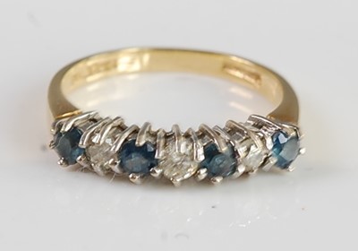 Lot 2688 - A modern 18ct gold, sapphire and diamond half...