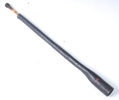Lot 343 - * A 19th century black leather balling gun, 47cm.