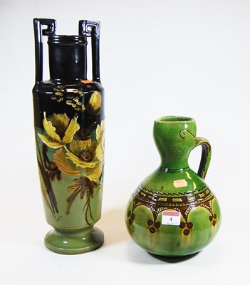 Lot 4 - A 20th century green glazed pottery urn...
