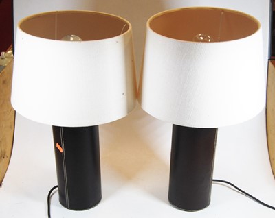Lot 24 - A pair of modern brown leather clad...