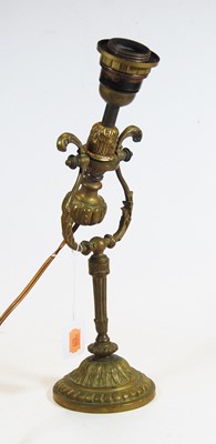 Lot 31 - An early 20th century brass adjustable table...
