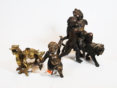 Lot 40 - A Chinese brass candlestick, in the form of a...